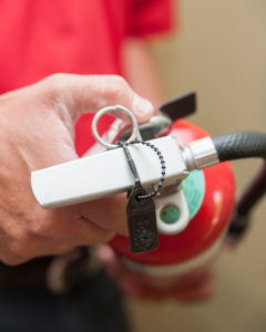 Man holding a fire extinguisher